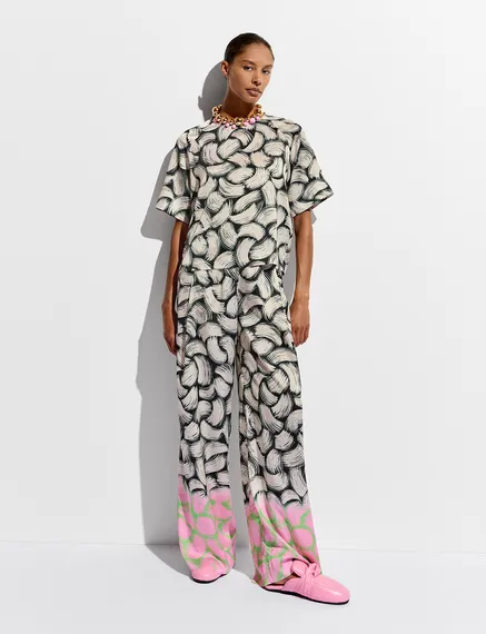 Schwarze, cremefarbene und rosa Hose mit abstraktem Print und weitem Bein