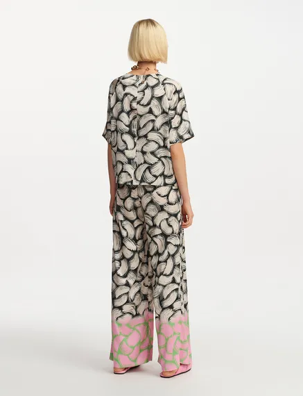 Schwarze, cremefarbene und rosa Hose mit abstraktem Print und weitem Bein