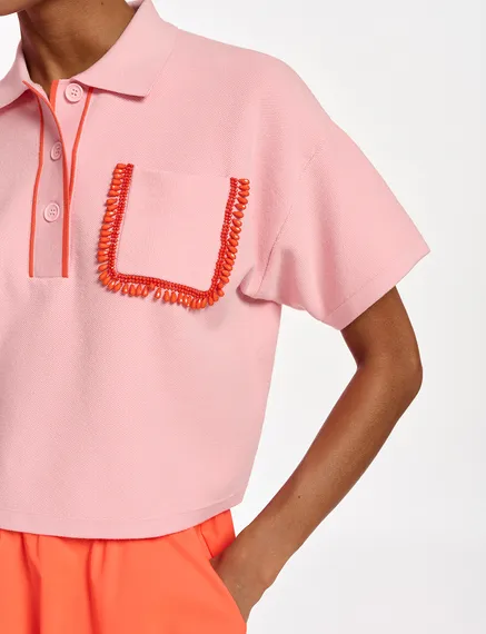 Light pink polo top with beaded embroidery