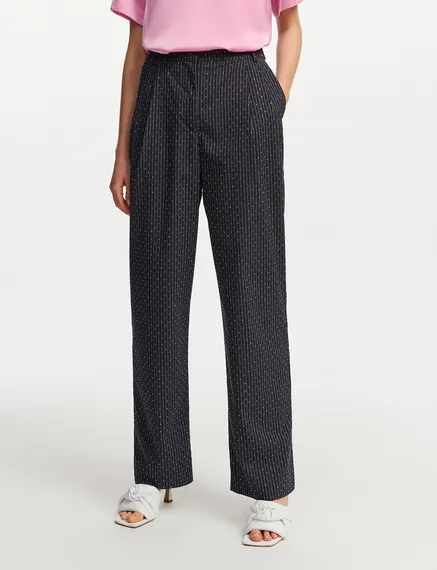 Navy blue pinstriped pants with rhinestone embellishments