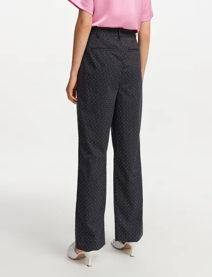 Navy blue pinstriped pants with rhinestone embellishments