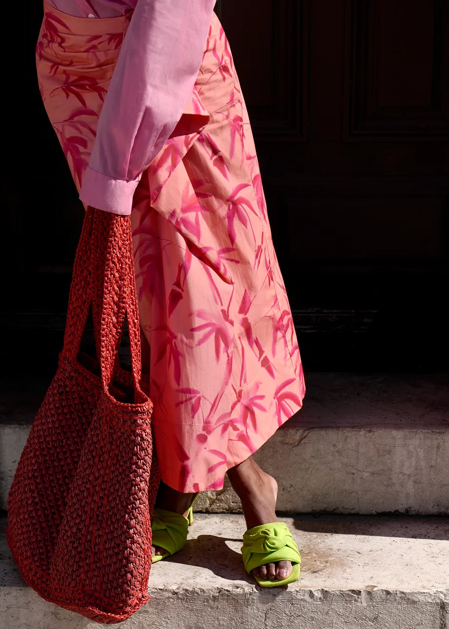 Peach cotton draped midi skirt with palm leaf print