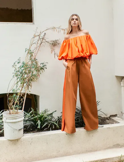 Bronze wide-leg pants with orange stripes