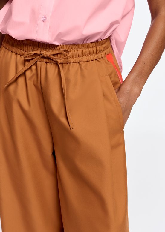 Bronze wide-leg pants with orange stripes