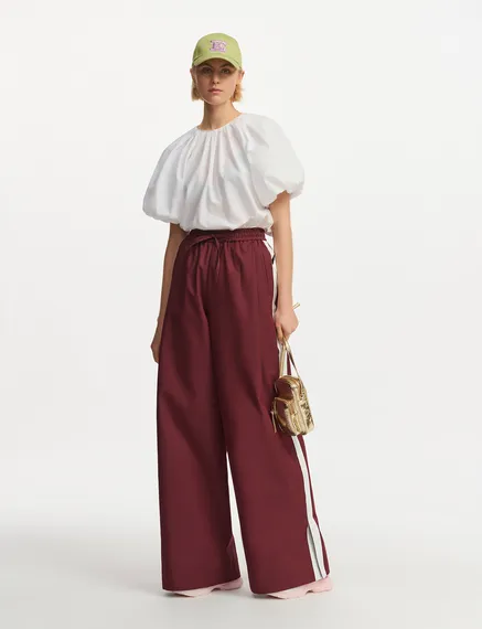 Burgundy wide-leg pants with white stripes