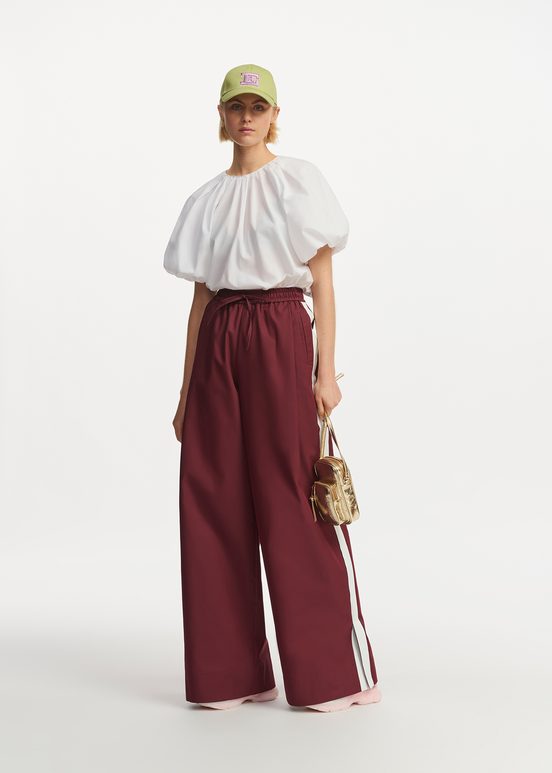 Burgundy wide-leg pants with white stripes