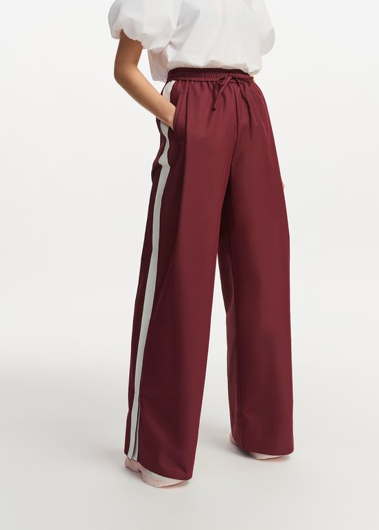 Burgundy wide-leg pants with white stripes