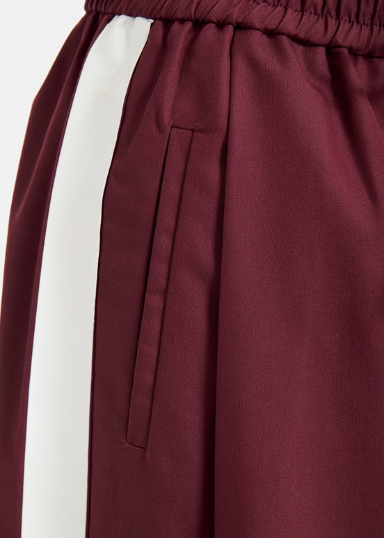 Burgundy wide-leg pants with white stripes