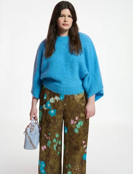 Blue knit sweater with cape effect