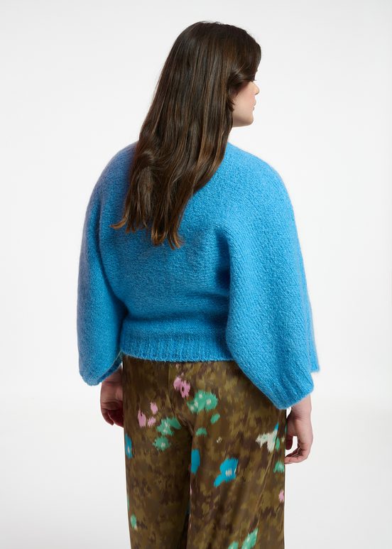 Blue knit sweater with cape effect