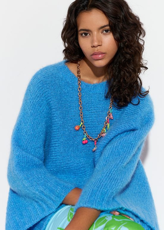 Blue knit sweater with cape effect