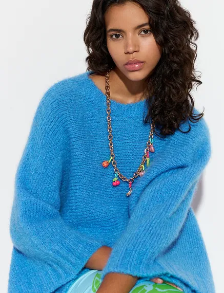 Blue knit sweater with cape effect