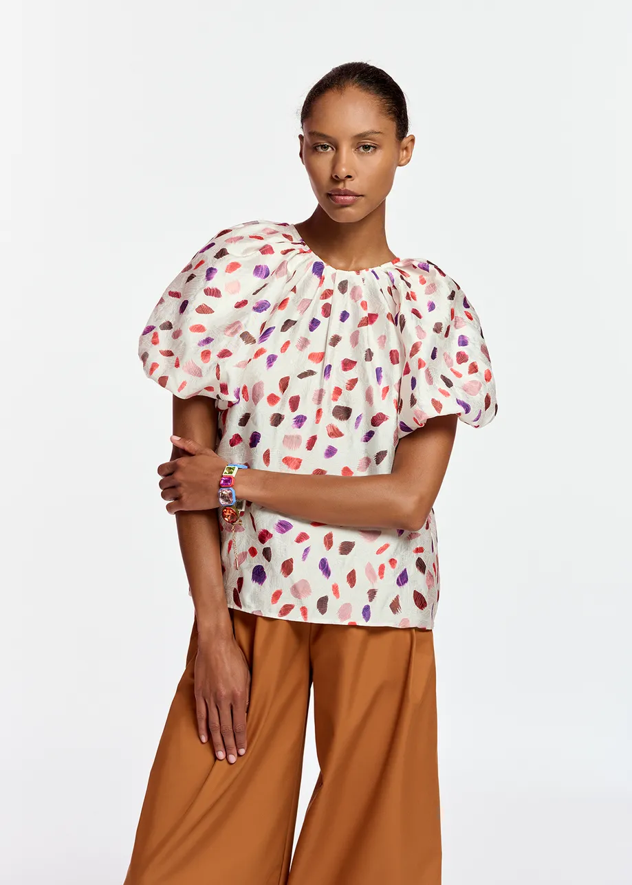 Off-white puffed-sleeve top with abstract print