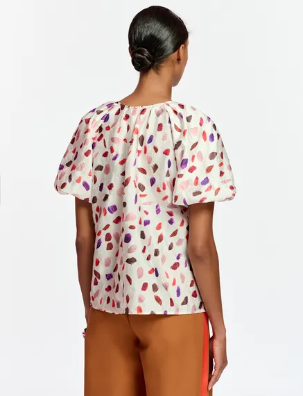 Off-white puffed-sleeve top with abstract print