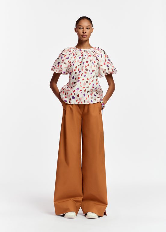 Off-white puffed-sleeve top with abstract print