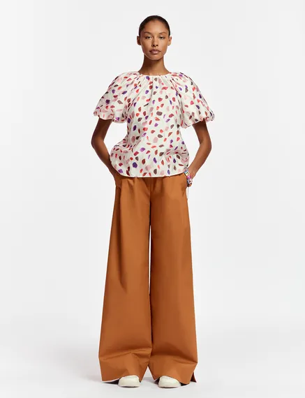 Off-white puffed-sleeve top with abstract print