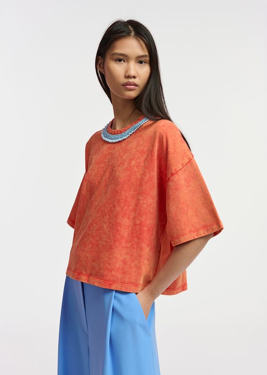 Orange cotton T-shirt with bead-embellished neckline