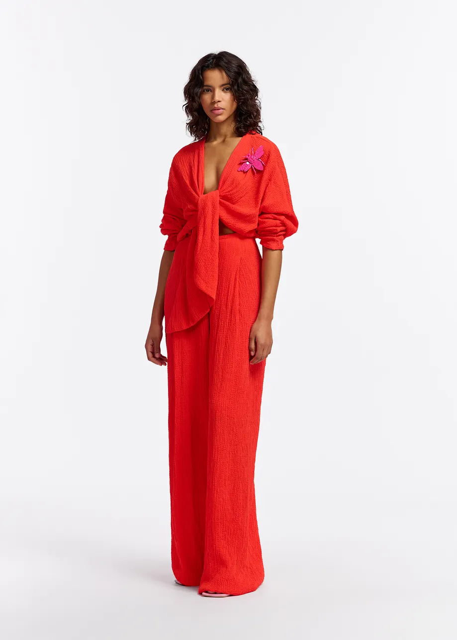 Red seersucker jumpsuit with tied front