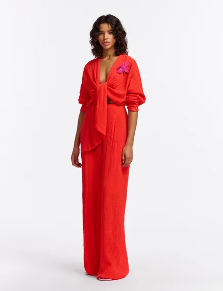 Red seersucker jumpsuit with tied front