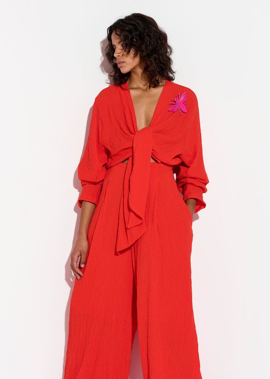 Red seersucker jumpsuit with tied front