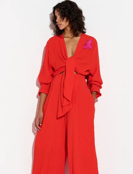 Red seersucker jumpsuit with tied front