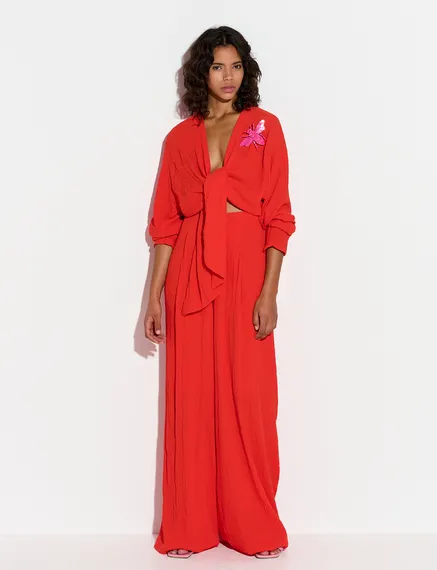 Red seersucker jumpsuit with tied front