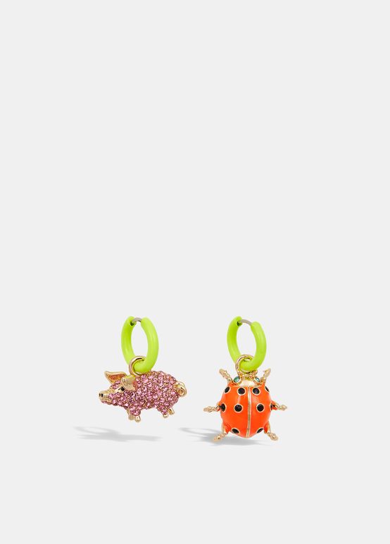 Lime green hoop earrings with pig and ladybug pendants