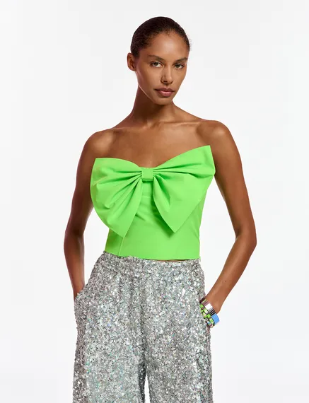 Neon green bustier top with bow