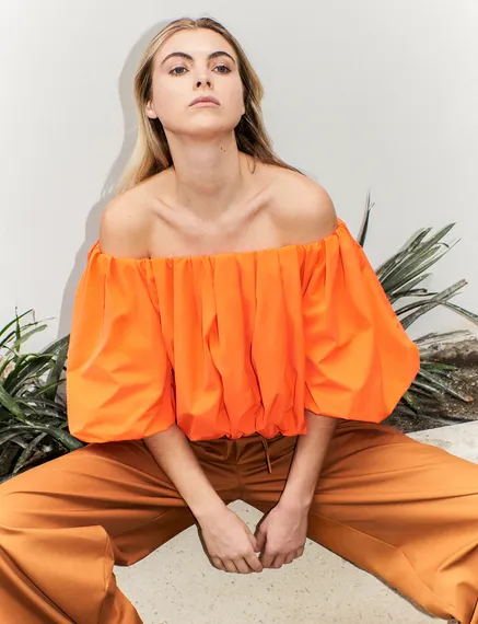 Orange gathered bodysuit with puffed sleeves