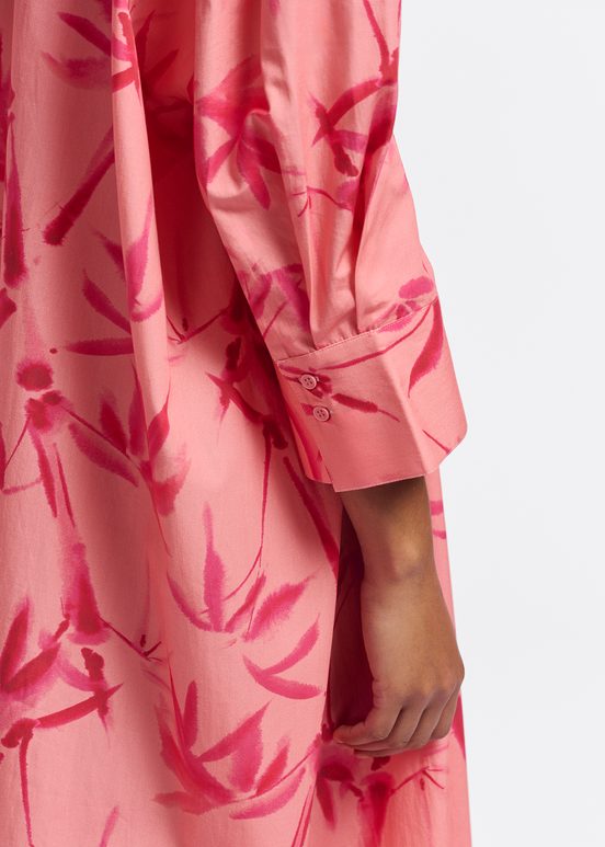 Peach and pink maxi-length dress with palm leaf print