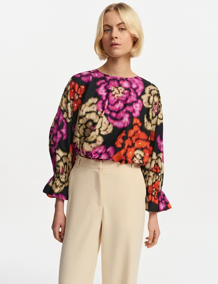 Black, orange and ecru top with puffed sleeves