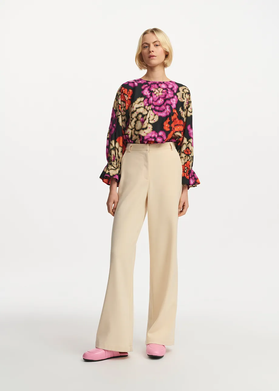 Black, orange and ecru top with puffed sleeves