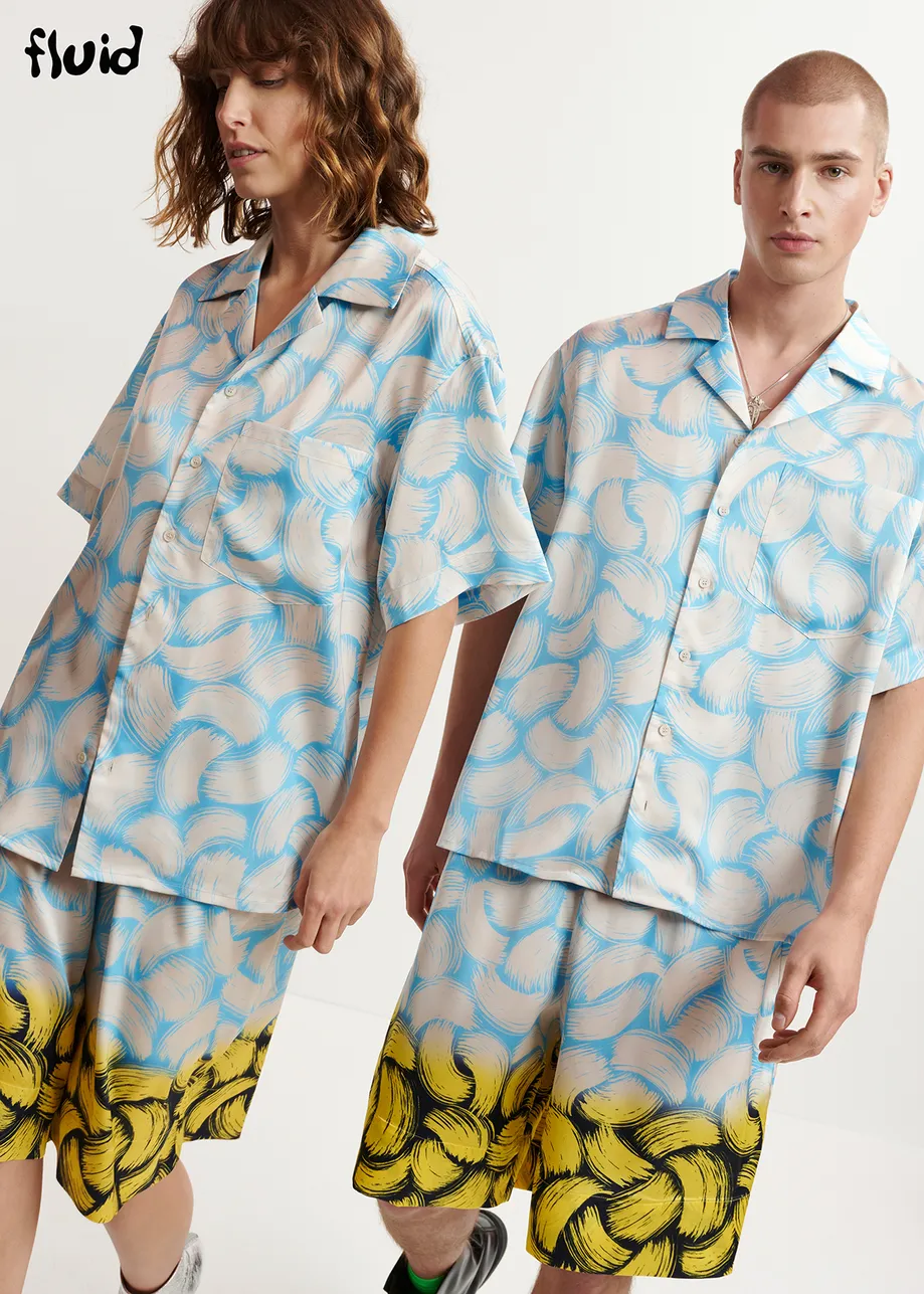 Blue and off-white short-sleeved shirt with abstract print
