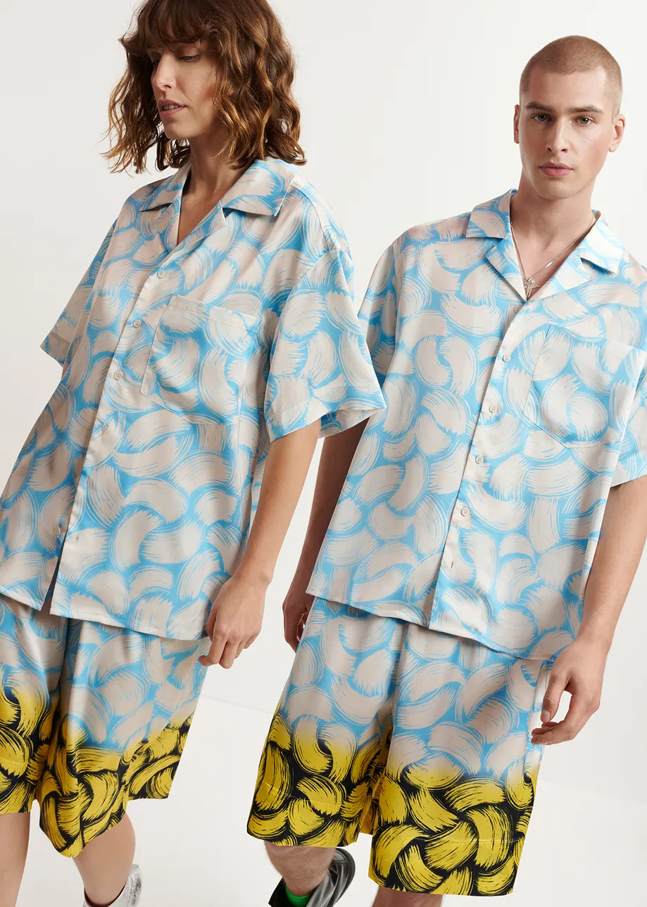 Blue and off-white short-sleeved shirt with abstract print