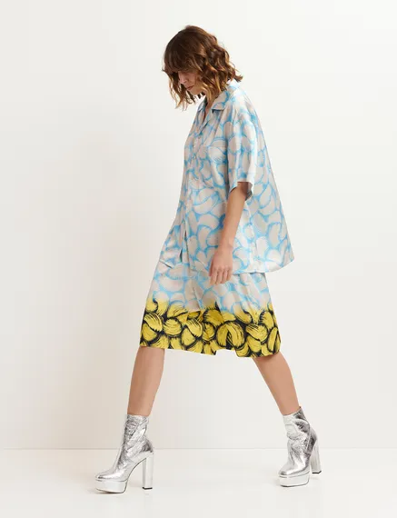 Blue and off-white short-sleeved shirt with abstract print