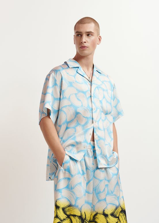 Blue and off-white short-sleeved shirt with abstract print