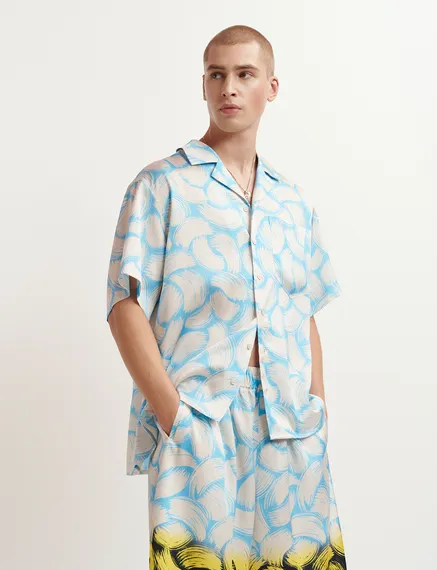 Blue and off-white short-sleeved shirt with abstract print