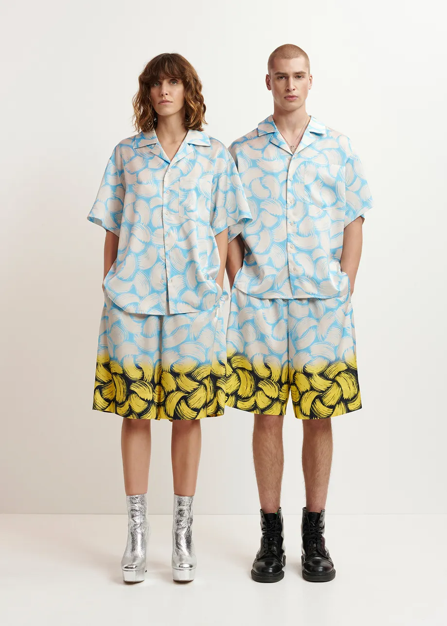 Blue and off-white short-sleeved shirt with abstract print