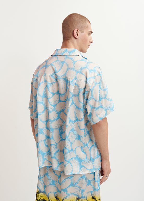 Blue and off-white short-sleeved shirt with abstract print