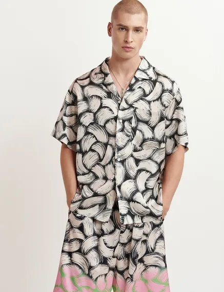 Black and off-white short-sleeved shirt with abstract print