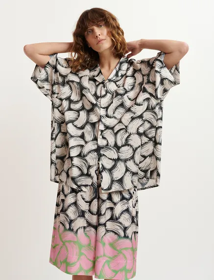 Black and off-white short-sleeved shirt with abstract print