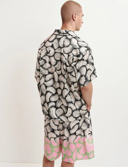 Black and off-white short-sleeved shirt with abstract print