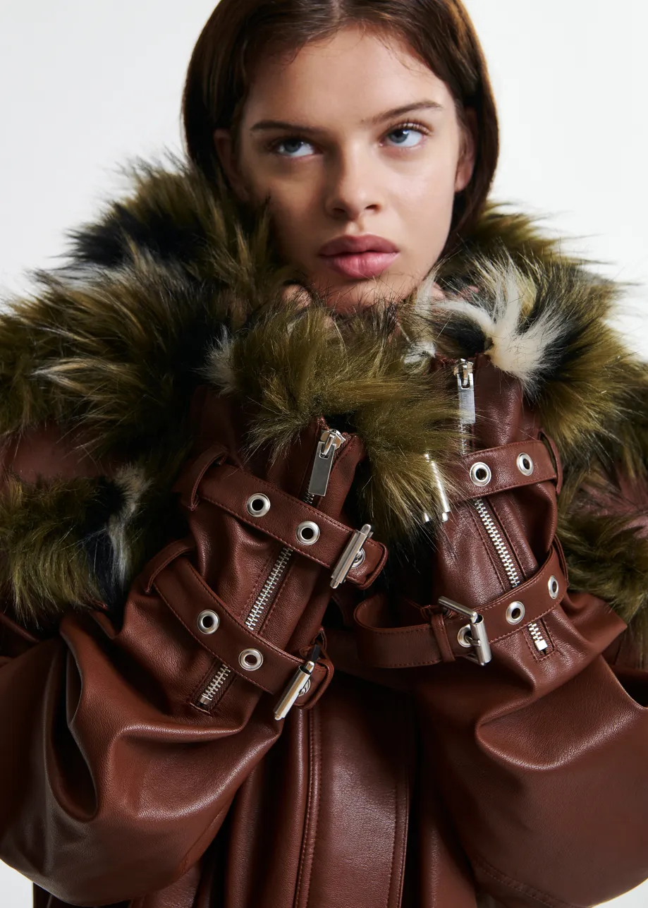 Brown oversized faux leather jacket with faux fur lining and buckle fastenings