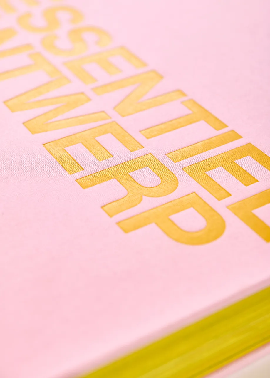 Pink and yellow 25 years coffee table book with exclusive paperweight