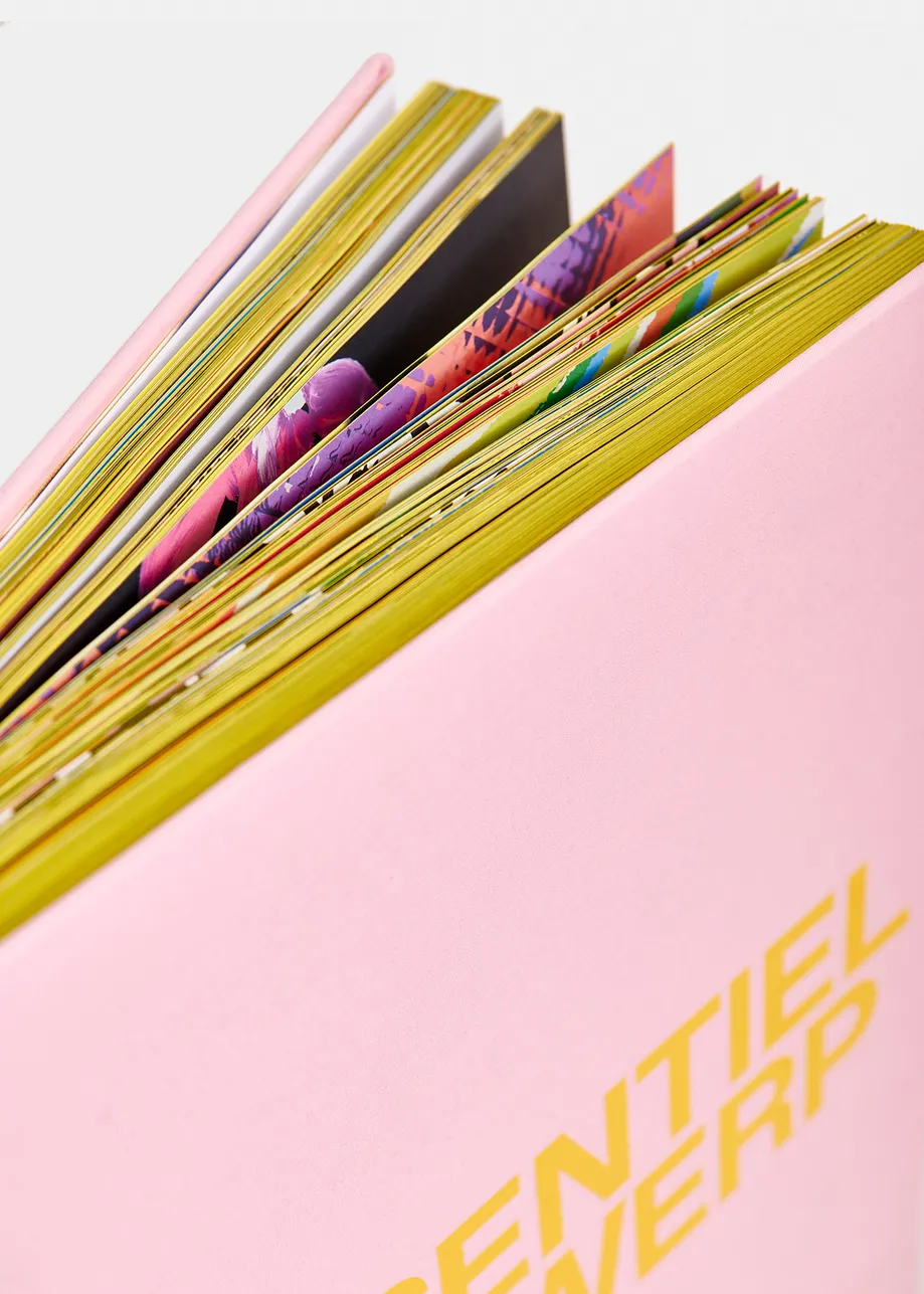 Pink and yellow 25 years coffee table book with exclusive paperweight