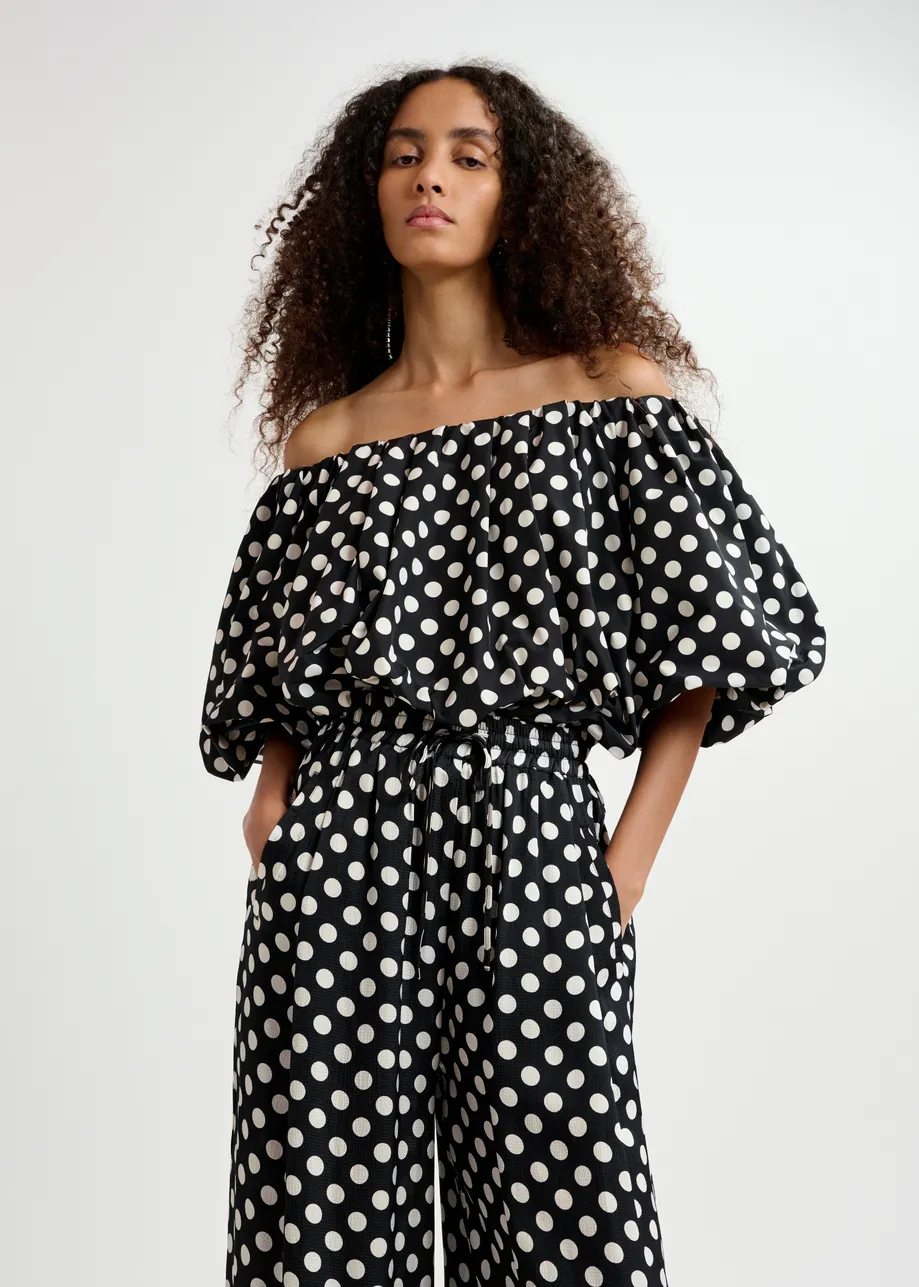 Black and white polka-dot gathered bodysuit with puffed sleeves