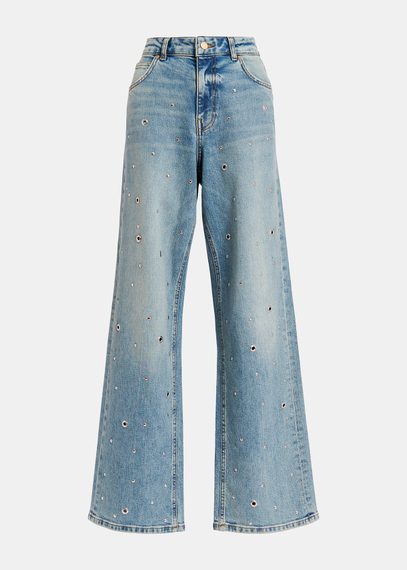 Jeans blu decorati con occhielli