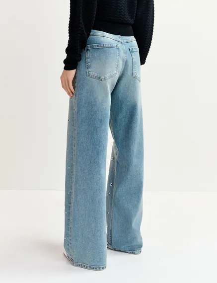 Blue eyelet-embellished jeans