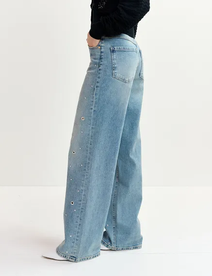 Blue eyelet-embellished jeans