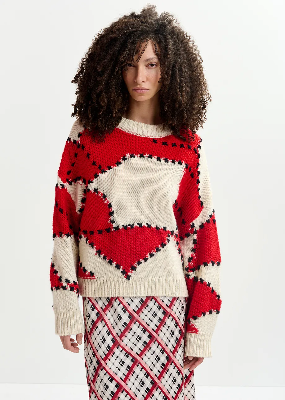 Ecrufarbener und roter Patchwork-Strickpullover